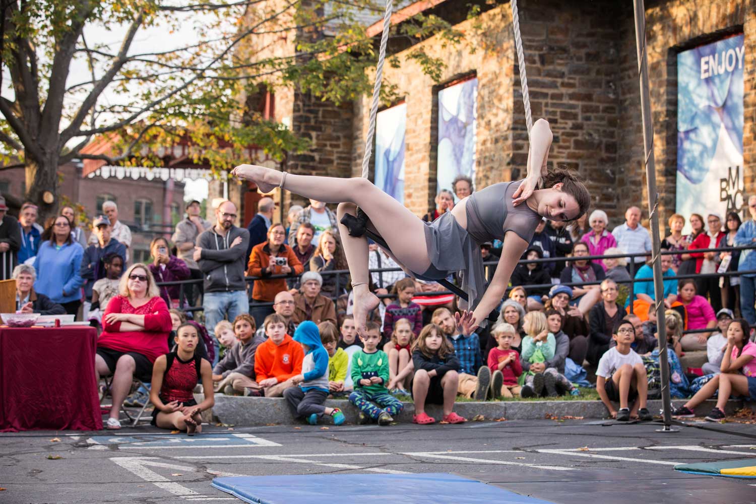 photo of Katie Schmidt, NECCA Coach, performing on dance trapeze